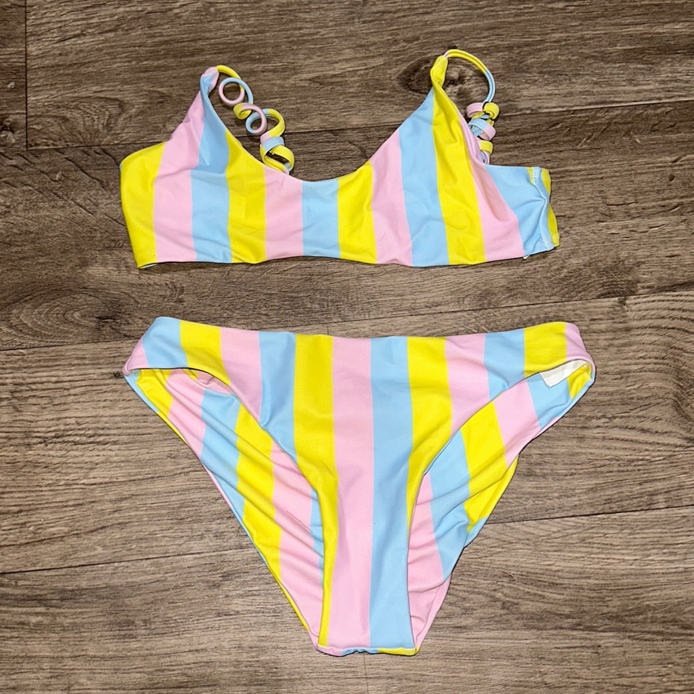 Rainbow bathing suit. Tag says M but it fits more like a small/x-small.
